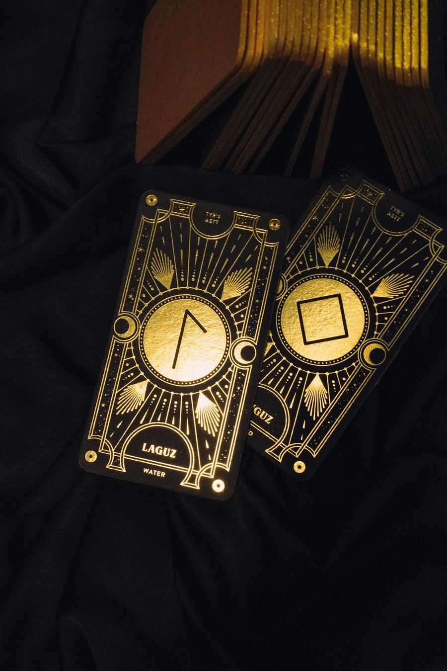 Cosmic Whisper luxury rune deck in black and gold by Cocorrina 