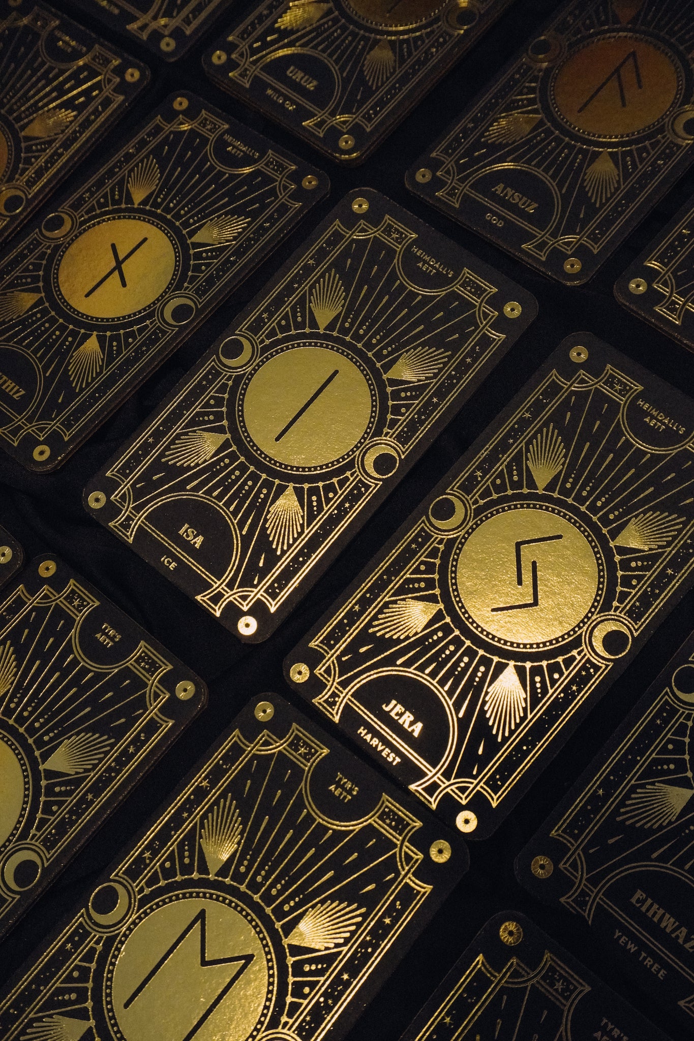 Cosmic Whisper luxury rune deck in black and gold by Cocorrina 