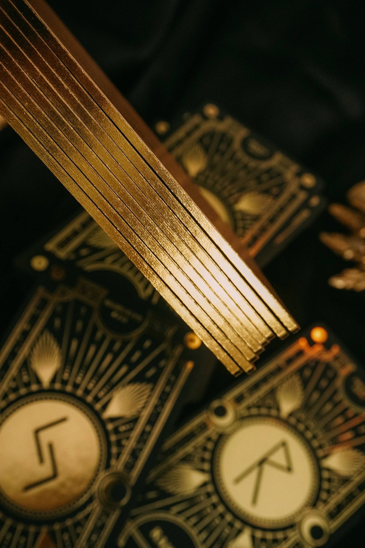 Cosmic Whisper luxury rune deck in black and gold by Cocorrina 