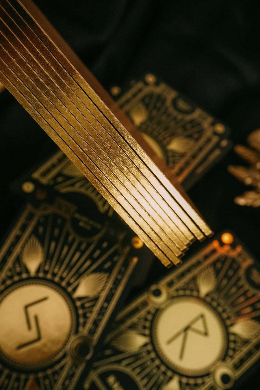 Cosmic Whisper luxury rune deck in black and gold by Cocorrina 