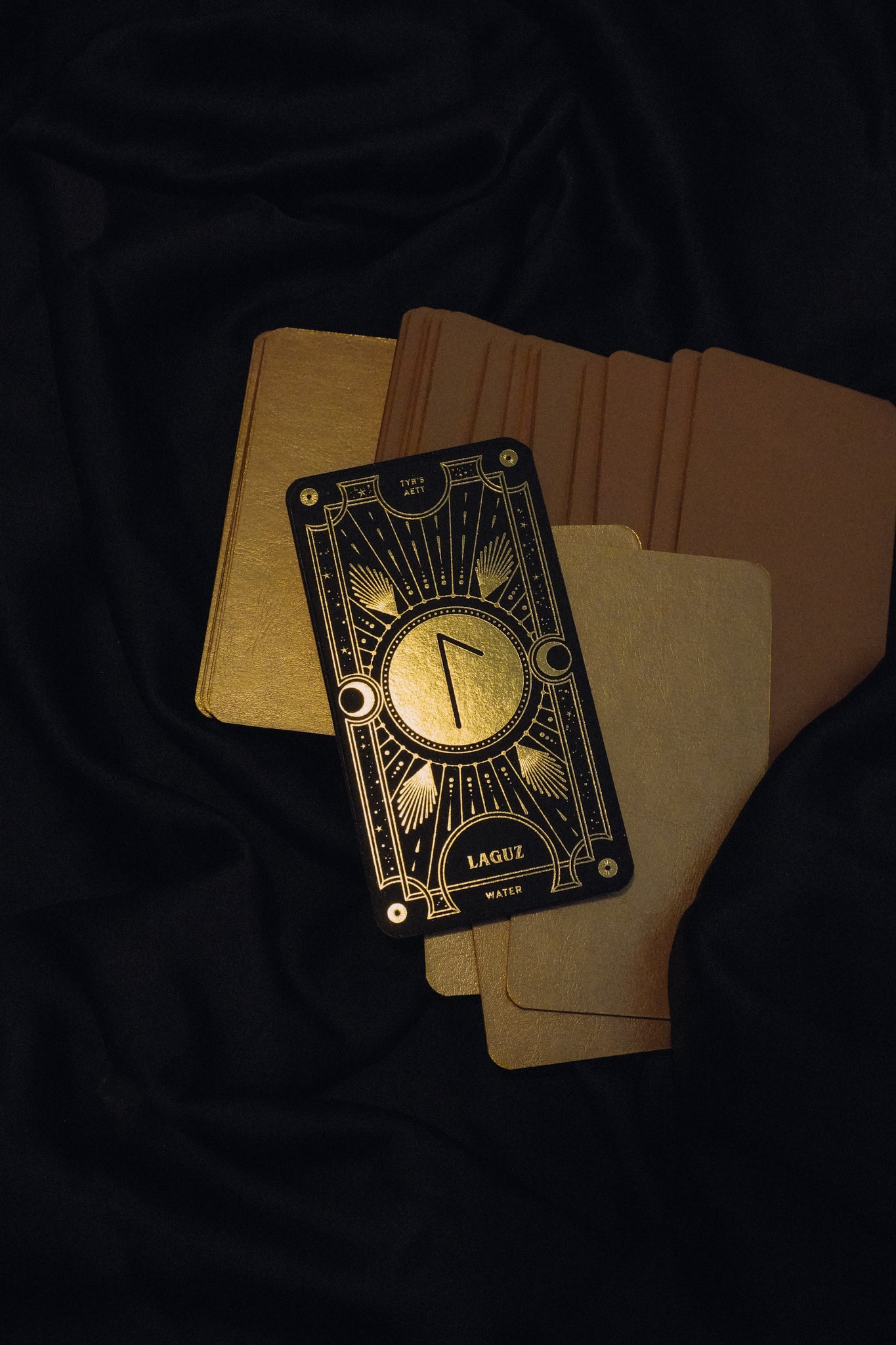 Cosmic Whisper luxury rune deck in black and gold by Cocorrina 