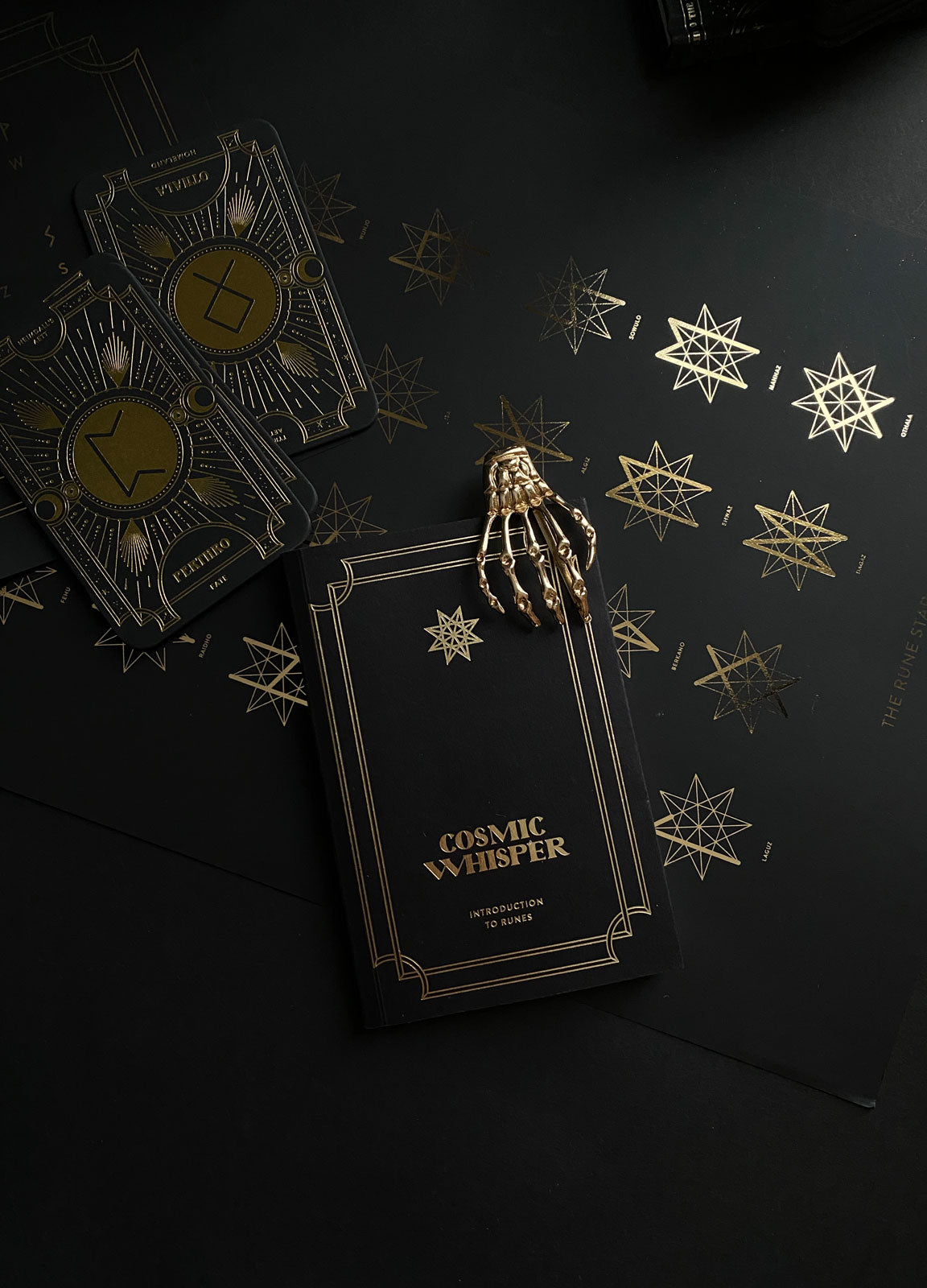 Cosmic Whisper rune deck by Cocorrina & Co in black and gold foil