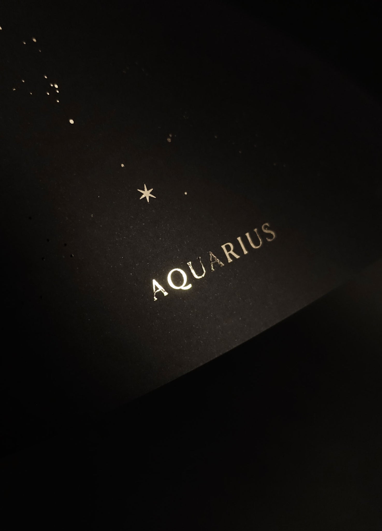 Aquarius zodiac constellation gold metallic foil print on black paper by Cocorrina