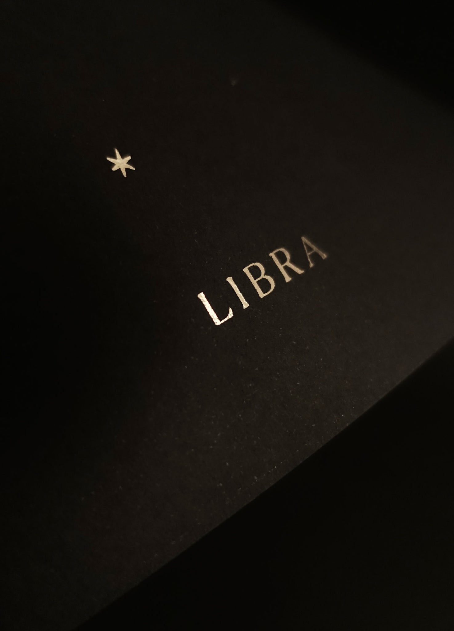 Libra zodiac constellation gold metallic foil print on black paper by Cocorrina