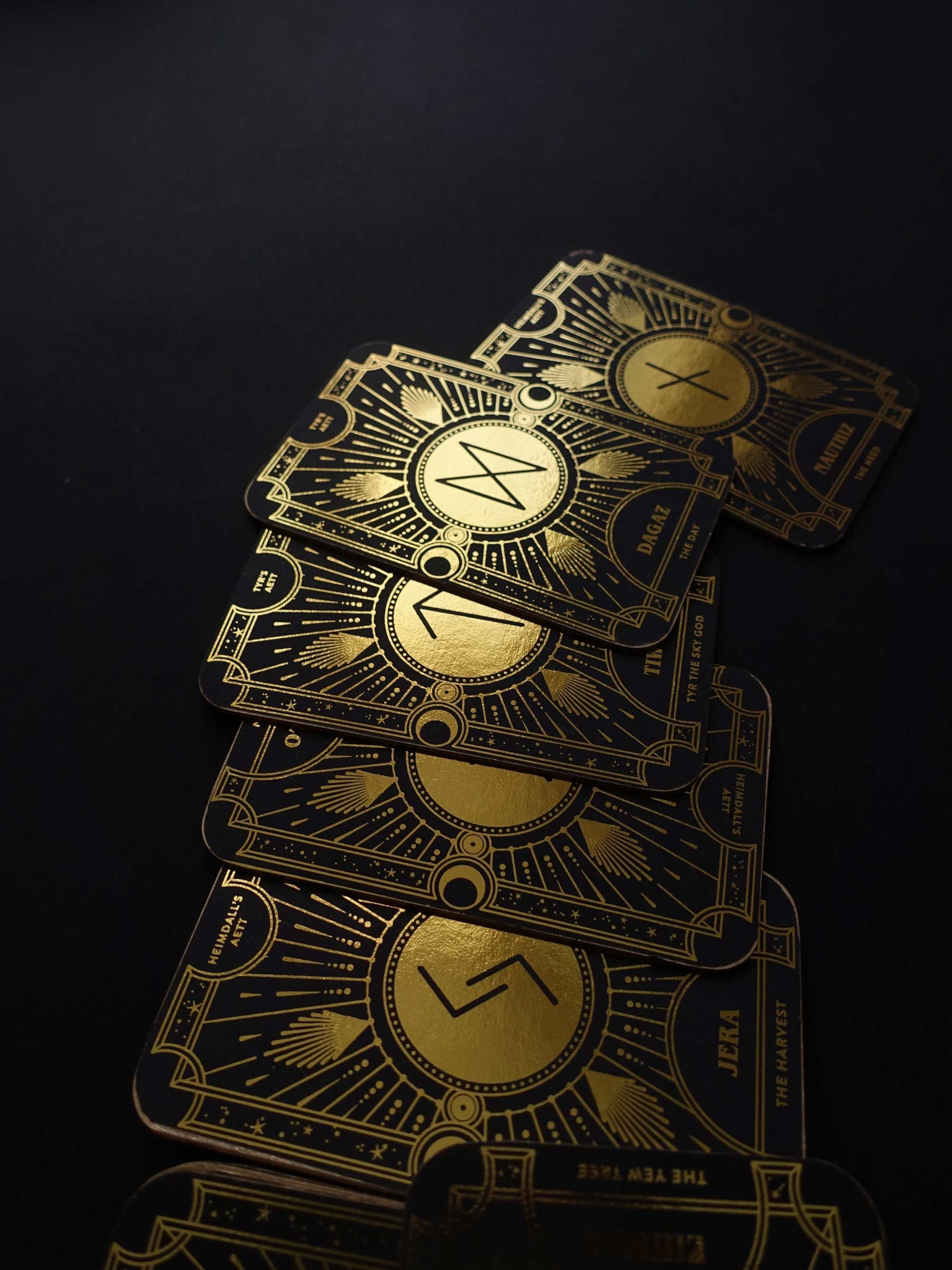 Cosmic Whisper rune deck by Cocorrina & Co in black and gold foil