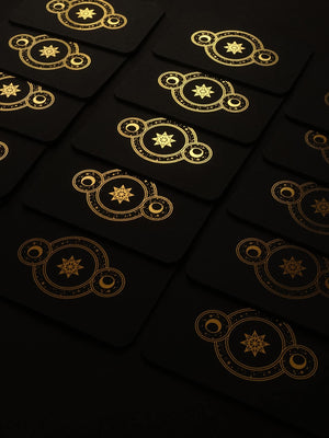 Cosmic Whisper rune deck by Cocorrina & Co in black and gold foil