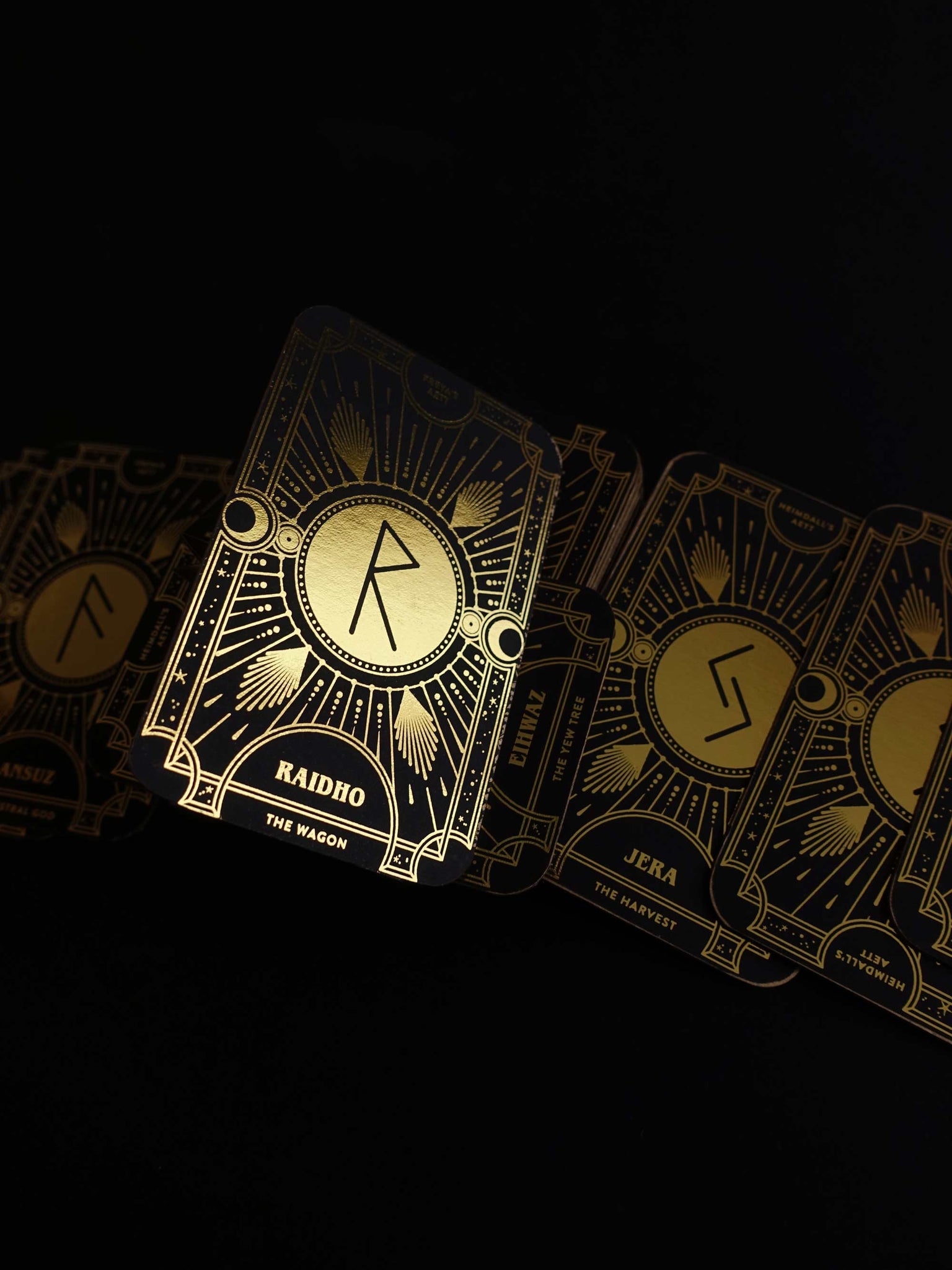 Cosmic Whisper rune deck by Cocorrina & Co in black and gold foil