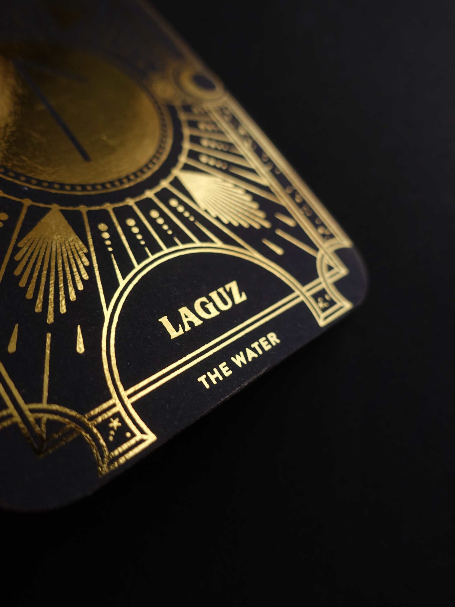 Cosmic Whisper rune deck by Cocorrina & Co in black and gold foil