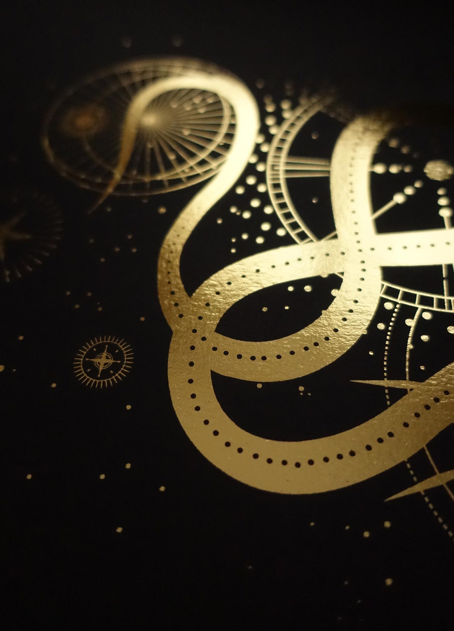 Sacred Snake art print in gold foil and black paper with stars and moon by Cocorrina