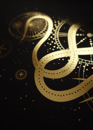 Sacred Snake art print in gold foil and black paper with stars and moon by Cocorrina
