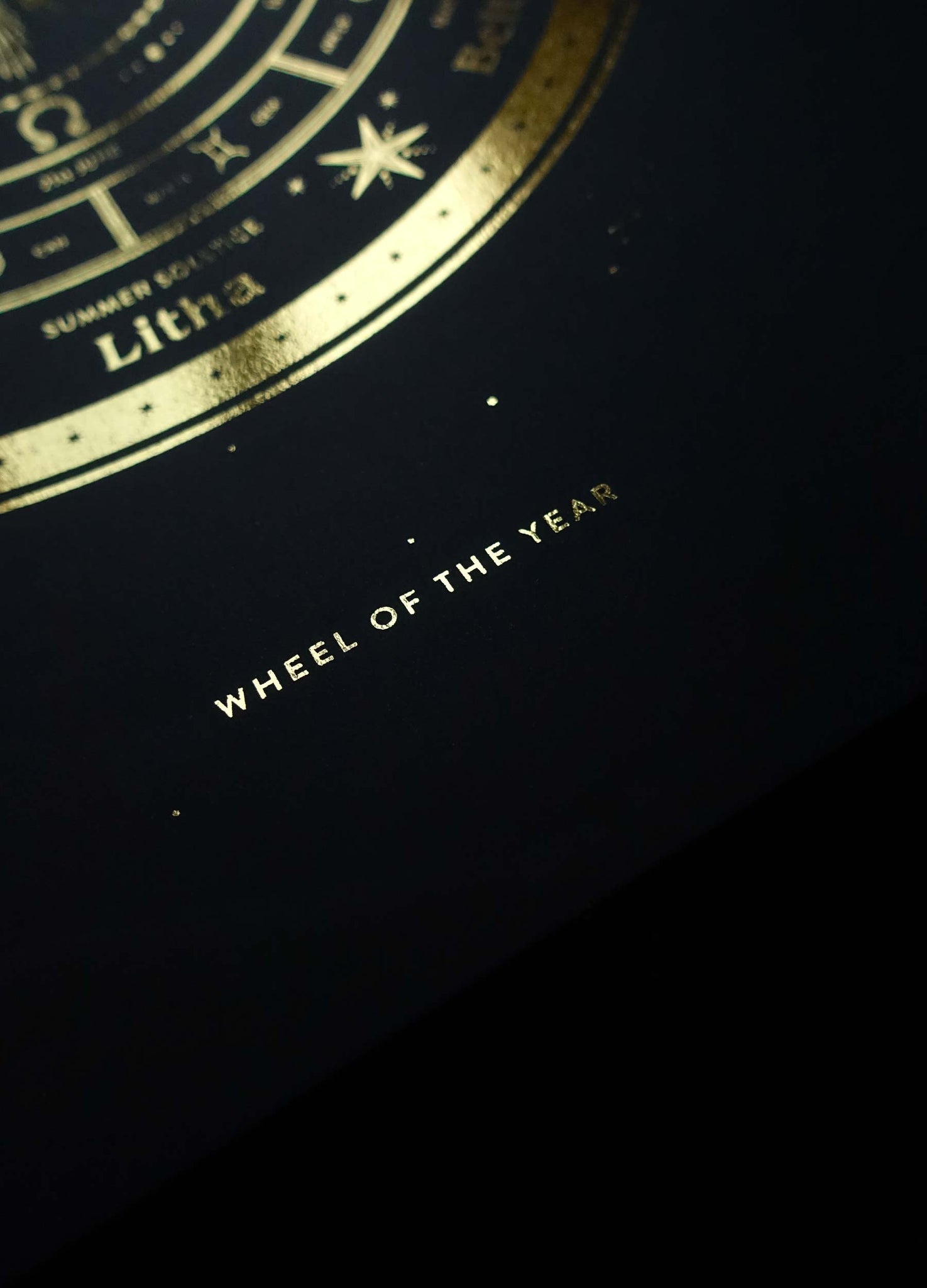Witch's wheel of the year holiday calendar art print in gold foil and black paper with stars and moon by Cocorrina