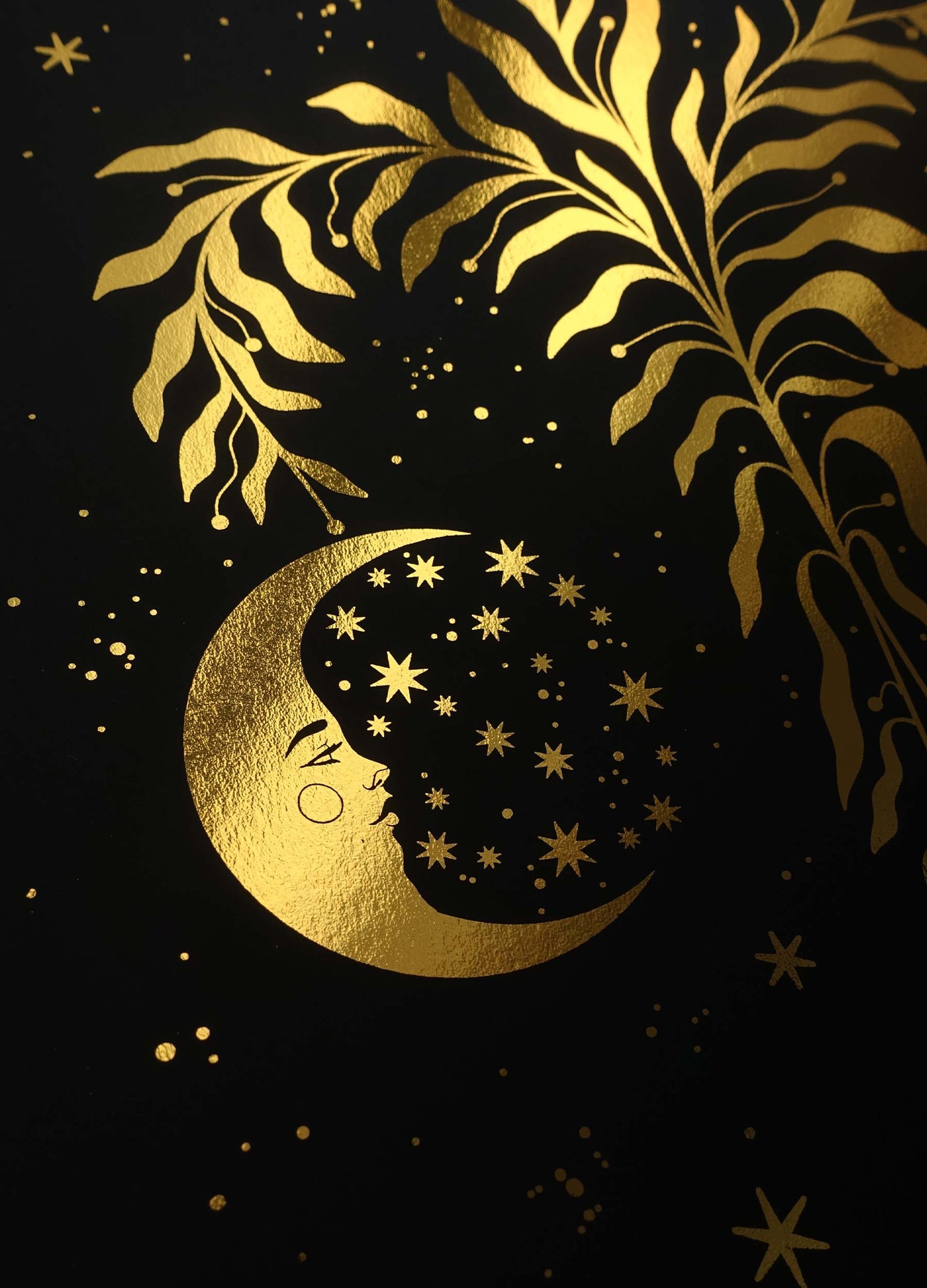 The Yule tree with a sun, moon and star gold foil art print on black paper by Cocorrina & Co